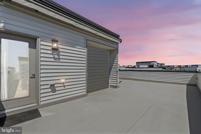 view of patio terrace at dusk