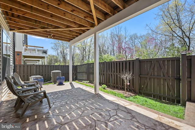 view of patio / terrace with a fenced backyard and central air condition unit
