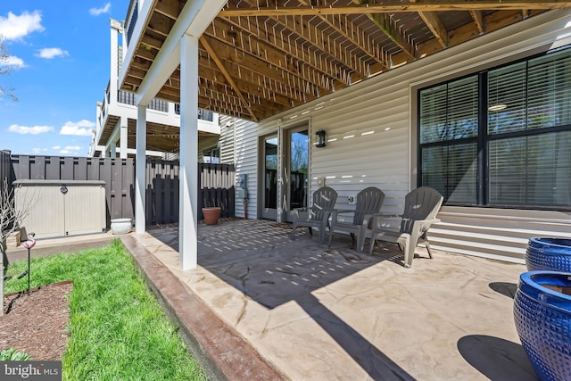 view of patio featuring fence