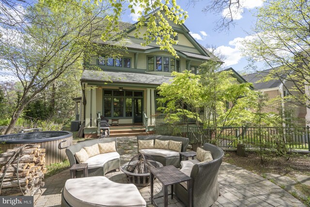 5402 Tuscarawas Rd, Bethesda, MD 20816 - view of patio / terrace with a wooden deck, an outdoor living space with a fire pit, and fence