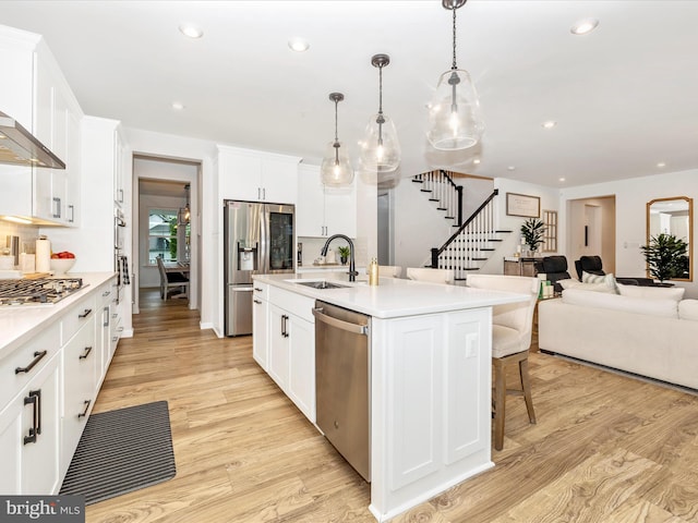 704 Kaplon Ct, Brunswick, MD 21716 - kitchen featuring stainless steel appliances, a sink, open floor plan, recessed lighting, and a breakfast bar area