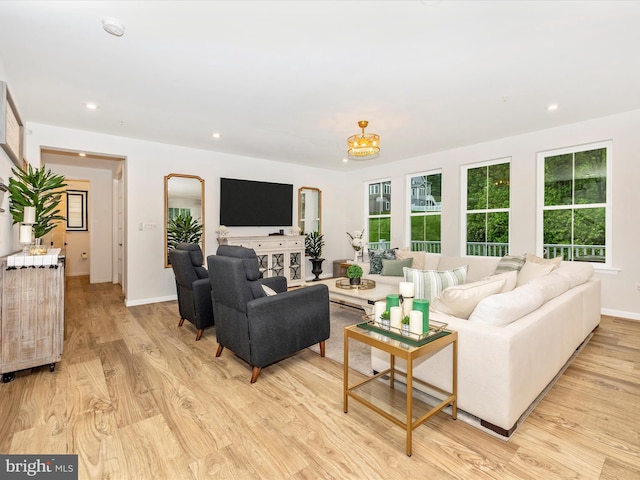 704 Kaplon Ct, Brunswick, MD 21716 - living area featuring light wood-type flooring, recessed lighting, baseboards, and a chandelier