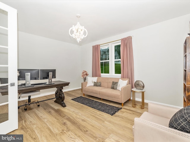 704 Kaplon Ct, Brunswick, MD 21716 - office area featuring wood finished floors, a chandelier, and baseboards