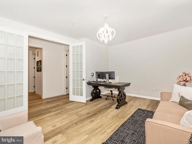 704 Kaplon Ct, Brunswick, MD 21716 - office area with wood finished floors, a chandelier, baseboards, and french doors