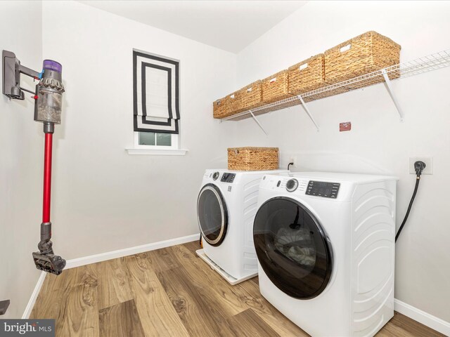 704 Kaplon Ct, Brunswick, MD 21716 - laundry room with washer and dryer, baseboards, and light wood-type flooring