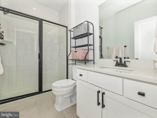 704 Kaplon Ct, Brunswick, MD 21716 - bathroom with tile patterned flooring, a shower stall, toilet, and vanity