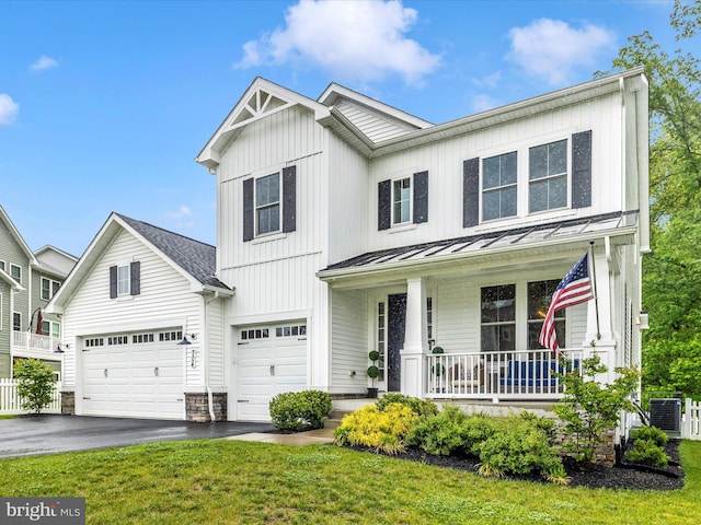 704 Kaplon Ct, Brunswick, MD 21716 - view of front of property with a porch, a standing seam roof, driveway, metal roof, and an attached garage