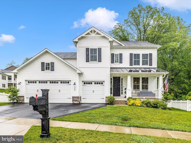 704 Kaplon Ct, Brunswick, MD 21716 - view of front of home featuring asphalt driveway, a porch, a standing seam roof, and a shingled roof