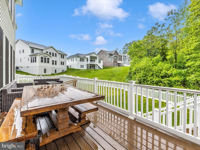 704 Kaplon Ct, Brunswick, MD 21716 - wooden deck with outdoor dining space, a residential view, and a lawn