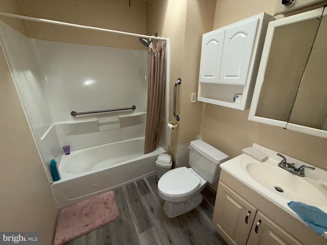 bathroom featuring shower / tub combo with curtain, vanity, toilet, and wood finished floors