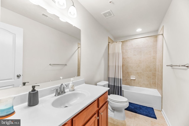 bathroom with vanity, toilet, tile patterned flooring, and visible vents