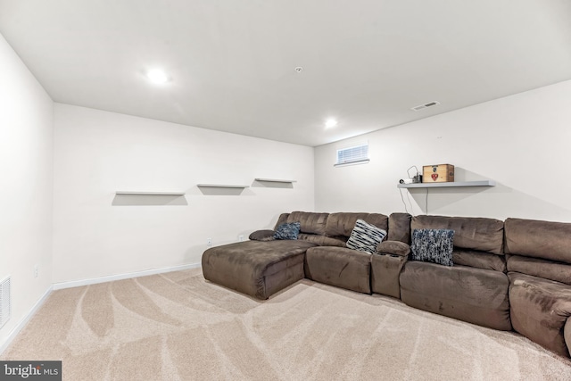 carpeted living area with recessed lighting, visible vents, and baseboards