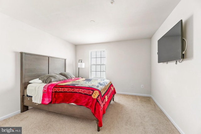 bedroom with baseboards and carpet flooring