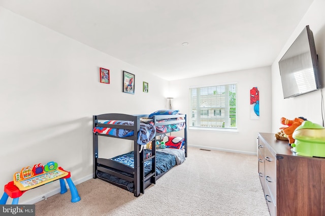 carpeted bedroom with baseboards