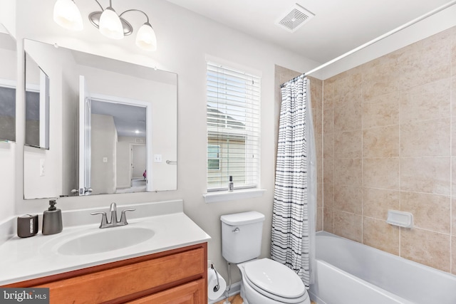 full bath featuring shower / bath combo, visible vents, vanity, and toilet
