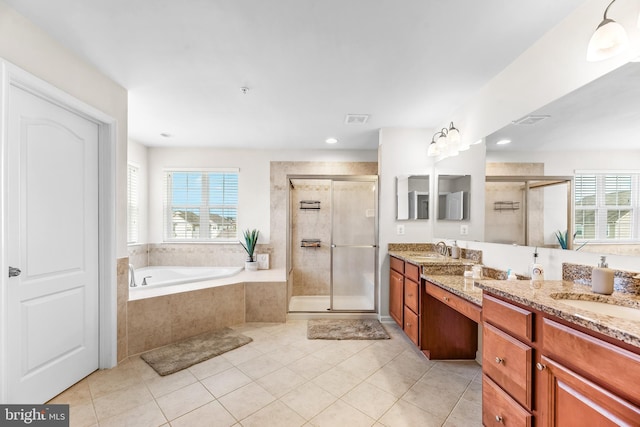 bathroom featuring a wealth of natural light, a sink, and a stall shower