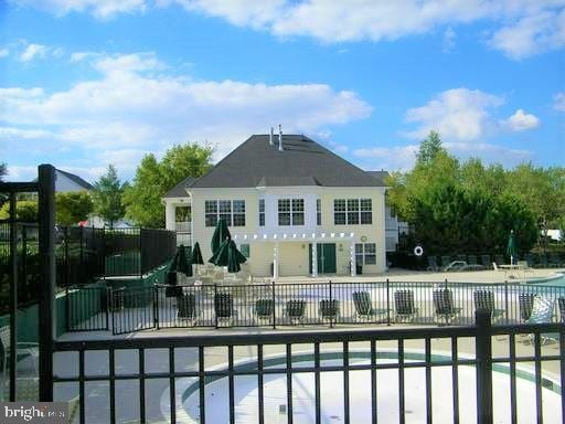 20347 Bowfonds St, Ashburn, VA 20147 - community pool with a patio and fence