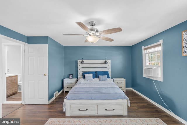 bedroom with cooling unit, dark wood finished floors, and baseboards