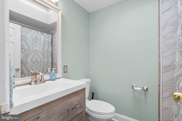 bathroom with toilet and vanity
