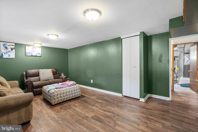 living room with wood finished floors and baseboards