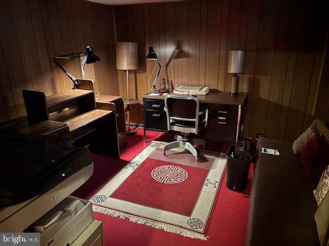 office space featuring wooden walls