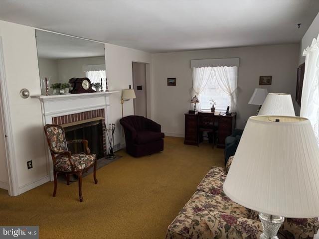 carpeted living room featuring a fireplace, baseboards, and a healthy amount of sunlight