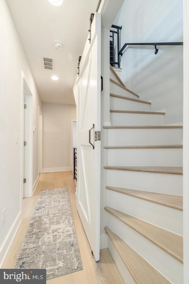 2625 Pratt St, Philadelphia, PA 19137 - stairs with visible vents, baseboards, recessed lighting, and a barn door