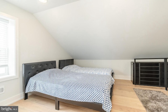 2625 Pratt St, Philadelphia, PA 19137 - bedroom with baseboards, wood finished floors, and lofted ceiling