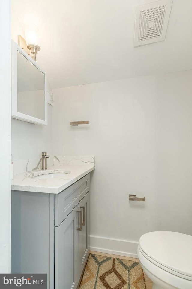 2625 Pratt St, Philadelphia, PA 19137 - half bathroom with vanity, baseboards, tile patterned floors, toilet, and visible vents