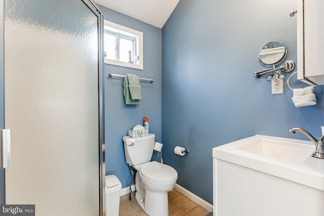 full bath with tile patterned floors, a sink, toilet, baseboards, and a shower stall