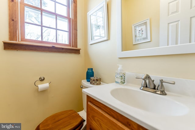 half bath with toilet and vanity