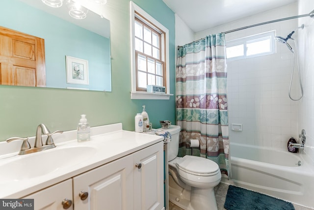 bathroom with shower / bath combo with shower curtain, vanity, and toilet