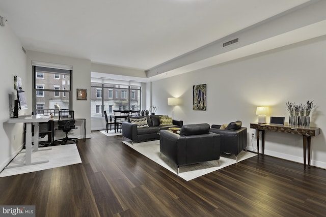 2425 L St NW Unit 205, Washington, DC 20037 - living area with baseboards, wood finished floors, and visible vents