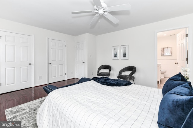 9644 Sutton Green Ct, Vienna, VA 22181 - bedroom featuring wood finished floors, ensuite bath, a ceiling fan, and baseboards