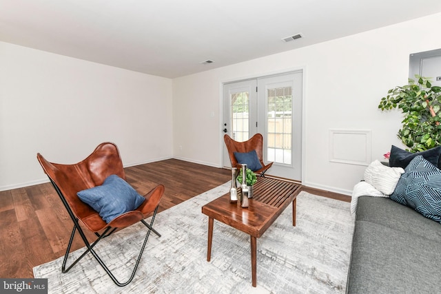 9644 Sutton Green Ct, Vienna, VA 22181 - living room with wood finished floors, french doors, and baseboards