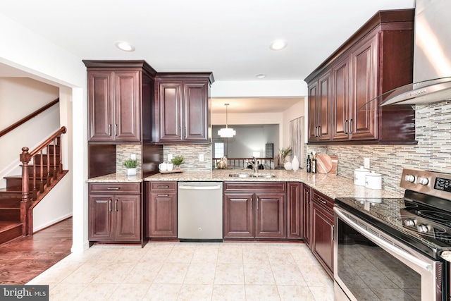 9644 Sutton Green Ct, Vienna, VA 22181 - kitchen with appliances with stainless steel finishes, wall chimney exhaust hood, a sink, backsplash, and light stone countertops