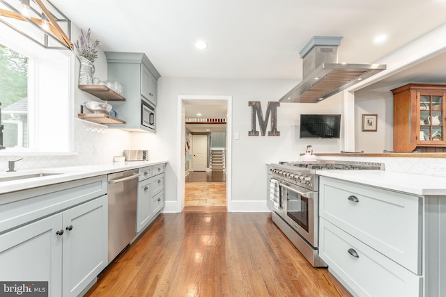 90 Indiantown Rd, Glenmoore, PA 19343 - kitchen with stainless steel appliances, backsplash, open shelves, light countertops, and recessed lighting