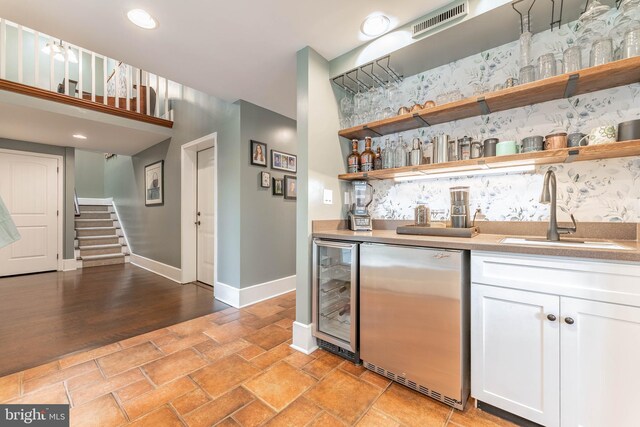 90 Indiantown Rd, Glenmoore, PA 19343 - indoor wet bar featuring stainless steel fridge, beverage cooler, stairway, baseboards, and recessed lighting