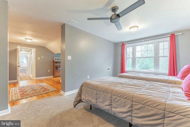 90 Indiantown Rd, Glenmoore, PA 19343 - bedroom with baseboards, vaulted ceiling, light colored carpet, a ceiling fan, and light wood finished floors