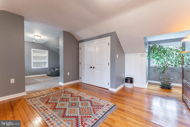 90 Indiantown Rd, Glenmoore, PA 19343 - bonus room with built in shelves, light wood-style floors, vaulted ceiling, and baseboards