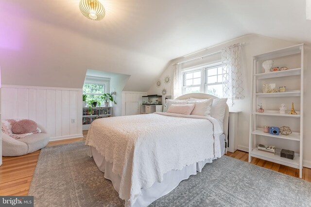 90 Indiantown Rd, Glenmoore, PA 19343 - bedroom with light wood-style flooring, vaulted ceiling, multiple windows, and wainscoting