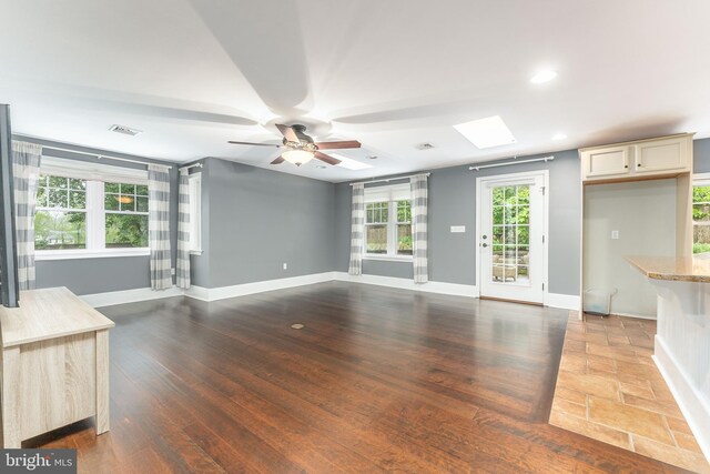 90 Indiantown Rd, Glenmoore, PA 19343 - unfurnished living room featuring a ceiling fan, a skylight, baseboards, recessed lighting, and wood finished floors