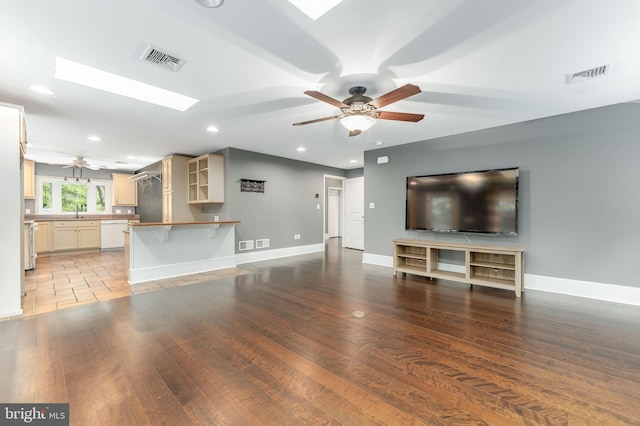 90 Indiantown Rd, Glenmoore, PA 19343 - unfurnished living room featuring ceiling fan, recessed lighting, wood finished floors, a skylight, and baseboards