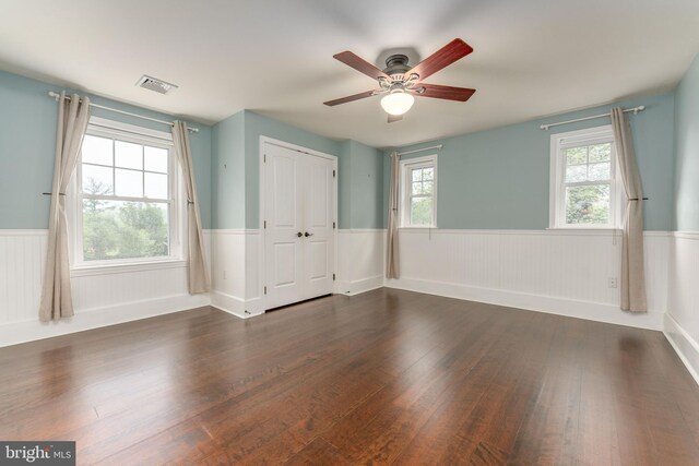 90 Indiantown Rd, Glenmoore, PA 19343 - unfurnished room featuring a wainscoted wall, dark wood-style floors, healthy amount of natural light, and a ceiling fan
