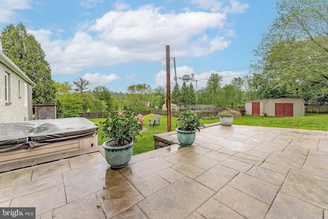 90 Indiantown Rd, Glenmoore, PA 19343 - view of patio / terrace featuring a hot tub, an outdoor structure, and a storage unit