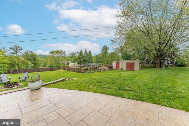 90 Indiantown Rd, Glenmoore, PA 19343 - view of patio with a shed, an outdoor fire pit, and an outbuilding