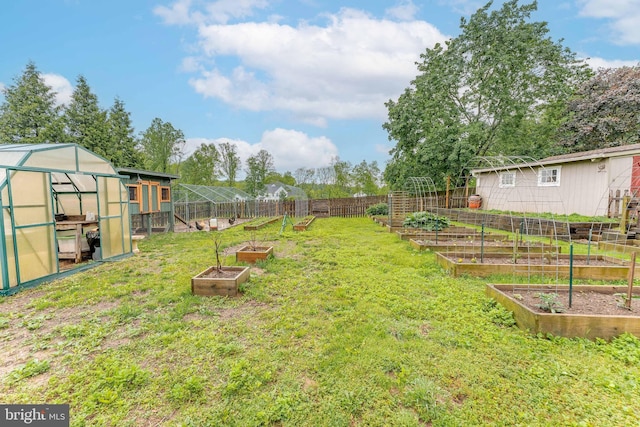 90 Indiantown Rd, Glenmoore, PA 19343 - view of yard featuring a garden, a greenhouse, and an outbuilding