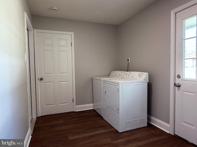 washroom with baseboards, laundry area, dark wood-style floors, and washing machine and clothes dryer