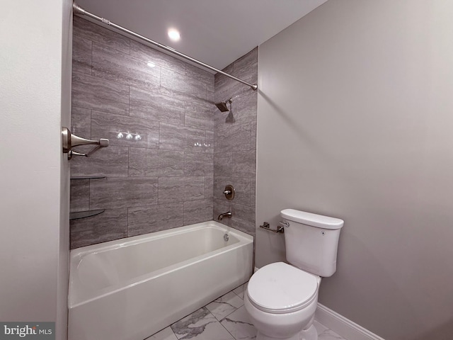 bathroom featuring toilet, baseboards, bathing tub / shower combination, and marble finish floor