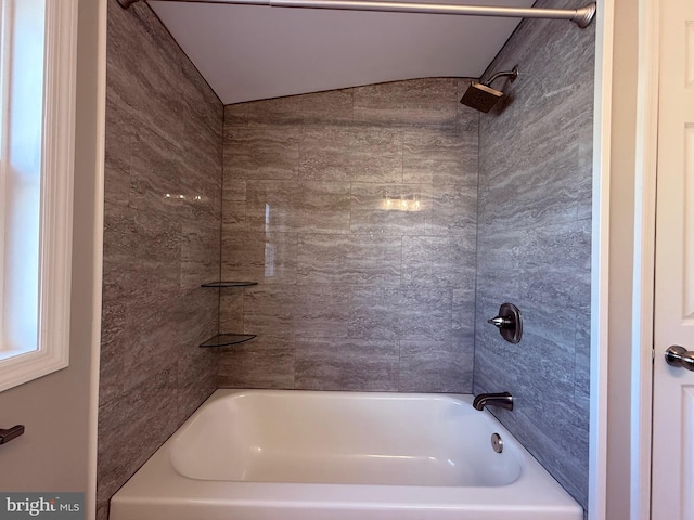 full bath with  shower combination and vaulted ceiling